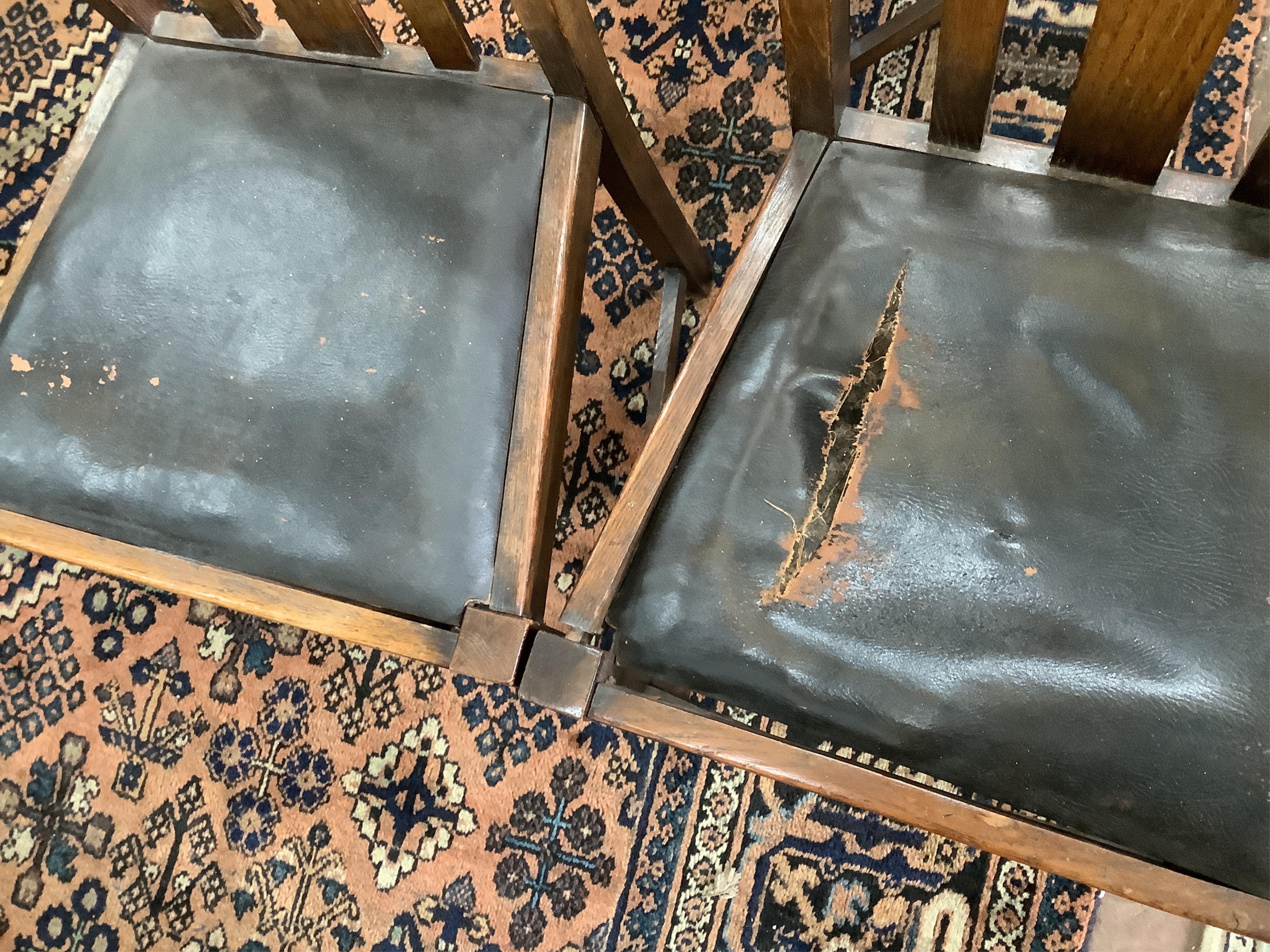 Eight 1920's oak dining chairs, two with arms